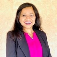 Professional headshot of Minal Mehta, certified notary public